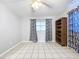 Bedroom with tile floors, window coverings and lots of natural light at 4510 W Mcelroy Ave, Tampa, FL 33611