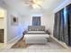 Main bedroom with a king-size bed and grey decor at 4510 W Mcelroy Ave, Tampa, FL 33611
