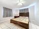 Spacious bedroom with king-size bed and window coverings at 4510 W Mcelroy Ave, Tampa, FL 33611