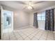 Bedroom with tile floor, window coverings and view of kitchen at 4510 W Mcelroy Ave, Tampa, FL 33611