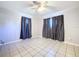 Bright bedroom with tile floors and ceiling fan at 4510 W Mcelroy Ave, Tampa, FL 33611