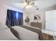 Bedroom with a queen-size bed and dark curtains at 4510 W Mcelroy Ave, Tampa, FL 33611