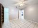 Bedroom with built-in shelves and ceiling fan at 4510 W Mcelroy Ave, Tampa, FL 33611