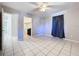 Bedroom with tile floors, closet, and ceiling fan at 4510 W Mcelroy Ave, Tampa, FL 33611