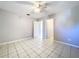 Spacious bedroom with tile floors and ceiling fan at 4510 W Mcelroy Ave, Tampa, FL 33611