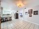 Open dining area with view into kitchen and living room at 4510 W Mcelroy Ave, Tampa, FL 33611