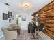 Home office with wood accent wall, two armchairs, and a desk at 4510 W Mcelroy Ave, Tampa, FL 33611