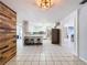Kitchen features an island with seating and modern appliances at 4510 W Mcelroy Ave, Tampa, FL 33611