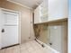 Laundry room with white cabinets and exterior access at 4510 W Mcelroy Ave, Tampa, FL 33611