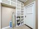 Well-organized laundry room with built-in shelving and storage at 4510 W Mcelroy Ave, Tampa, FL 33611