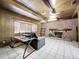 Living room features a stone fireplace and built-in shelving at 4510 W Mcelroy Ave, Tampa, FL 33611