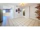 Living room with wood-paneled accent wall and tile floor at 4510 W Mcelroy Ave, Tampa, FL 33611