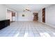 Spacious living area featuring tile flooring and sliding glass doors at 4510 W Mcelroy Ave, Tampa, FL 33611
