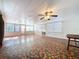 Spacious sunroom with terracotta tile floor and window coverings at 4510 W Mcelroy Ave, Tampa, FL 33611
