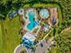 Aerial view of community pool, playground, and clubhouse at 5344 Little Stream Ln, Wesley Chapel, FL 33545