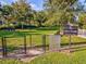 Fenced dog park with benches and waste disposal at 5344 Little Stream Ln, Wesley Chapel, FL 33545