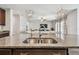 Kitchen island with double sink overlooking the living room at 5344 Little Stream Ln, Wesley Chapel, FL 33545