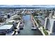 Stunning aerial view of waterfront condos and boat docks, surrounded by beautiful canals and neighborhood streets at 5915 Sea Ranch Dr # 408, Hudson, FL 34667