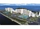 Scenic aerial view of waterfront condos with tennis courts and water views on a sunny day at 5915 Sea Ranch Dr # 408, Hudson, FL 34667