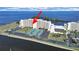 Aerial view of a waterfront complex, highlighting tennis courts, parking areas, and proximity to the water at 5915 Sea Ranch Dr # 408, Hudson, FL 34667