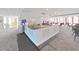 Elegant bar area features granite countertop, modern appliances, seating, and stylish decor, ideal for entertaining at 5915 Sea Ranch Dr # 408, Hudson, FL 34667