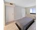 Bedroom featuring a plush bed, natural light, and convenient access to amenities at 5915 Sea Ranch Dr # 408, Hudson, FL 34667