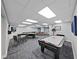Spacious game room with pool table, air hockey, card table and television at 5915 Sea Ranch Dr # 408, Hudson, FL 34667