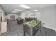 Bright and airy game room with various activities, including a pool table and foosball table at 5915 Sea Ranch Dr # 408, Hudson, FL 34667