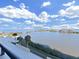 Gorgeous panoramic water view from the property's balcony, with islands and blue skies at 5915 Sea Ranch Dr # 408, Hudson, FL 34667