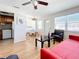 Living room, dining area, and kitchen with hardwood floors at 5925 18Th N St # 11, St Petersburg, FL 33714