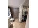 Bathroom with shower, toilet and walk-in closet at 6020 Shore S Blvd # 301, Gulfport, FL 33707