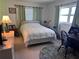 Cozy bedroom with a double bed, desk and rocking chair at 6020 Shore S Blvd # 301, Gulfport, FL 33707