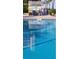 Sparkling community pool reflecting a tiki bar at 6020 Shore S Blvd # 301, Gulfport, FL 33707