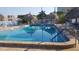 Inviting community pool with ample lounge chairs at 6020 Shore S Blvd # 301, Gulfport, FL 33707