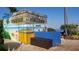 Fun tiki bar with beach mural, perfect for entertaining at 6020 Shore S Blvd # 301, Gulfport, FL 33707