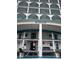 Windsor building exterior, featuring multiple balconies and a covered entrance at 6020 Shore S Blvd # 301, Gulfport, FL 33707