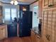 Modern kitchen with granite counters, wood cabinets, and black appliances at 6020 Shore S Blvd # 301, Gulfport, FL 33707