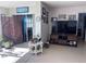 Spacious living room with large TV and water views at 6020 Shore S Blvd # 301, Gulfport, FL 33707