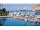 Refreshing community pool with bay views and lounge chairs at 6020 Shore S Blvd # 301, Gulfport, FL 33707