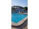 Community pool with surrounding lounge chairs at 6020 Shore S Blvd # 301, Gulfport, FL 33707