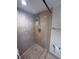 Walk-in shower with tiled walls and grab bars at 6020 Shore S Blvd # 301, Gulfport, FL 33707