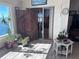 Sunroom with water views and many plants at 6020 Shore S Blvd # 301, Gulfport, FL 33707