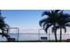 Scenic waterfront view with palm trees and swings at 6020 Shore S Blvd # 301, Gulfport, FL 33707