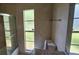 Bathroom featuring granite countertop, shower with glass door, and toilet at 6906 Quail Hollow Blvd, Wesley Chapel, FL 33544