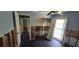 Bedroom featuring damage to walls, dark floors, closet, and a window at 6906 Quail Hollow Blvd, Wesley Chapel, FL 33544