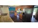 Kitchen area featuring stainless steel appliances, stone countertops, and damage to walls at 6906 Quail Hollow Blvd, Wesley Chapel, FL 33544