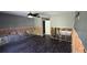 Spacious living room features dark-stained flooring and ceiling fan at 6906 Quail Hollow Blvd, Wesley Chapel, FL 33544