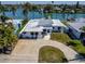 Waterfront home with circular driveway and private dock at 728 Pruitt Dr, Madeira Beach, FL 33708