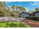 Two-car garage with gray doors and landscaping at 750 71St S Ter, St Petersburg, FL 33705