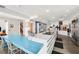 Modern kitchen with stainless steel appliances and white cabinetry, featuring an island at 750 71St S Ter, St Petersburg, FL 33705